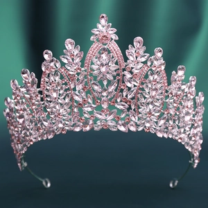 Detailed view of pink crystal wedding crown with silver alloy and floral rhinestones