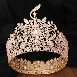 Golden baroque pageant crown with colorful rhinestones and intricate filigree details