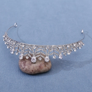 Detailed macro view of silver bridal crown with 3A zircon and intricate leaf patterns