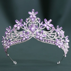 Detailed close-up of purple marquise crystal bridal crown with silver floral vine patterns