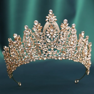 Close-up of champagne gold bridal crown with marquise crystals and floral details