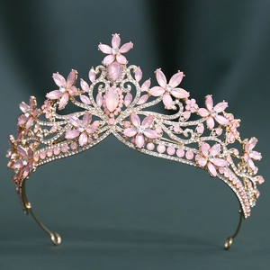 Baroque golden crystal bridal crown with pink gemstone floral rhinestones on dark background
