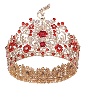 Detailed macro view of Baroque pageant crown with red gemstones and sparkling crystals