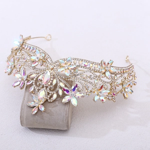 Macro shot of gold baroque bridal crown with crystal petals and sparkling rhinestones