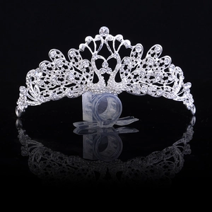 Detailed macro view of silver wedding crown featuring swan motifs and sparkling rhinestones