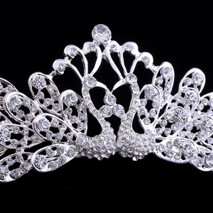 Elegant silver swan crown bridal tiara with sparkling crystal rhinestones on black background