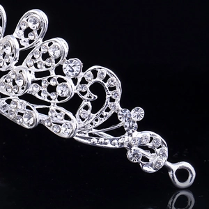 Elegant silver bridal tiara with sparkling rhinestones and delicate curved hollow patterns