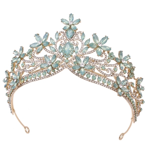 Detailed macro view of mint green crystal flowers on a golden bridal wedding tiara