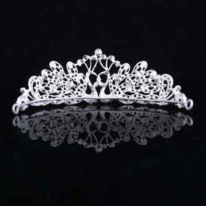 Rear view detail of silver bridal crown showing intricate hollow patterns and secure loops