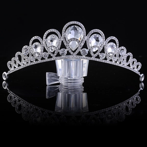Luxurious silver bridal crown with glittering rhinestones and elegant pear-shaped crystals