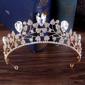 Detailed view of Baroque bridal crown featuring gold leaf textures and pear-cut rhinestones