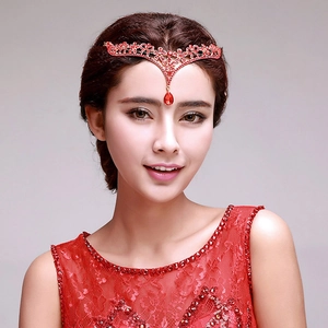 European fairy queen bridal tiara with red crystals and teardrop pendant on a model