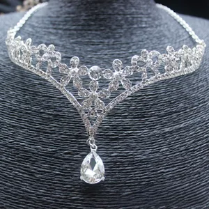 Detailed view of silver flower necklace with rhinestone petals and a teardrop pendant