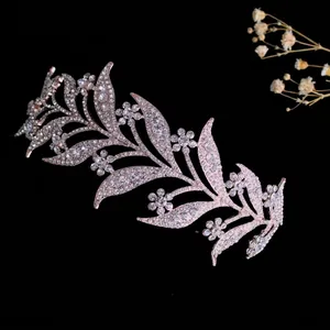 Close-up of alloy bridal crown featuring intricate rhinestone leaves and floral details
