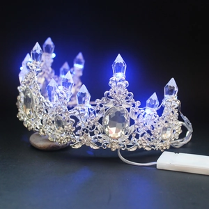 Detail view of crystal crown with blue LED lights and silver rhinestone setting