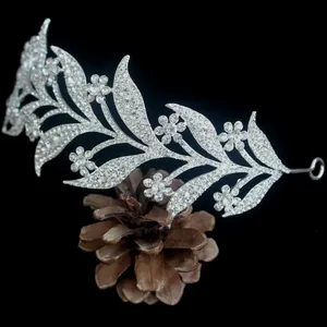 Macro view of silver bridal tiara with floral leaf design and white rhinestones