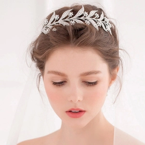 Elegant silver leaf bridal crown with sparkling white rhinestones for wedding hairstyles