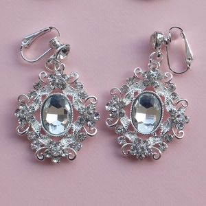 Silver drop earrings with oval white crystals and baroque floral openwork design