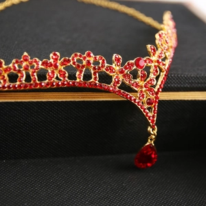 European bridal flower crown with red rhinestones and teardrop pendant on gold base