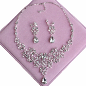 Elegant bridal jewelry set with silver crystal floral necklace and drop earrings in pink box