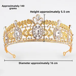 Close-up of luxury Baroque bridal crown with clear crystals and golden alloy leaf details