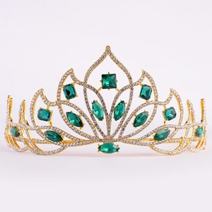 European bridal tiara with emerald green crystals and sparkling rhinestones on gold frame