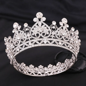 Baroque silver bridal tiara with sparkling rhinestones on a black velvet background