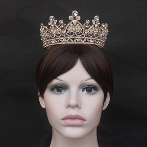 Front view of a baroque style tiara with heart patterns and sparkling rhinestones