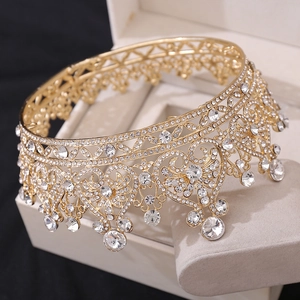 Golden Baroque bridal crown with heart patterns and sparkling crystals for weddings