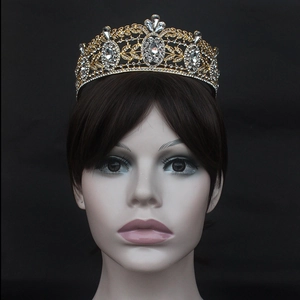 Baroque bridal tiara with sparkling crystals and gold alloy leaf patterns on black background