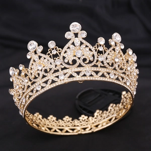Macro detail of Baroque bridal crown featuring golden alloy heart scrolls and clear rhinestones