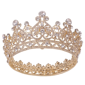 Baroque style gold bridal tiara with sparkling crystal rhinestones on a white background