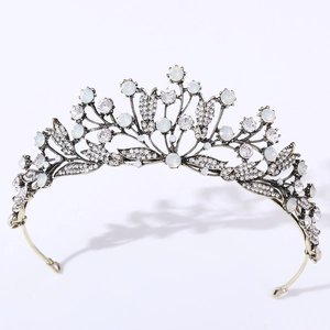Detail view of vintage leaf bridal tiara with white opal stones and clear rhinestones