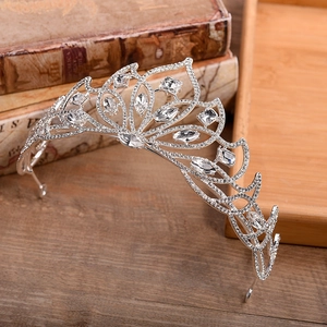 Close-up of silver bridal tiara with marquise crystals on vintage book display