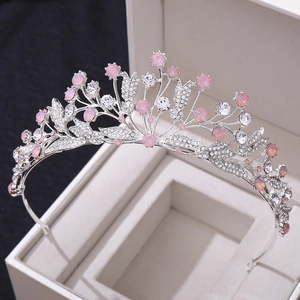 Vintage silver bridal tiara with pink rhinestones and leaf design on a white box