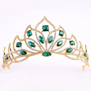 Detailed macro view of European style bridal crown with green emeralds and white crystals