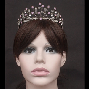 Close-up of vintage bridal leaf crown with pink crystals and white rhinestones