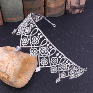 Luxurious European style bridal tiara with silver zircon crown on vintage books background