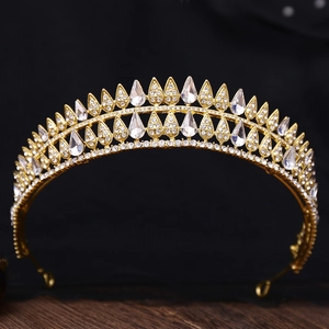 Vintage gold baroque bridal crown featuring teardrop crystals and shimmering rhinestones