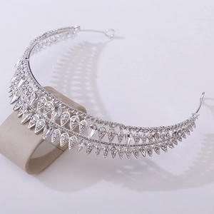 Detailed macro view of teardrop crystals and silver metal on Baroque bridal crown