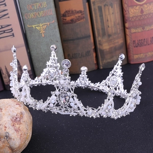 Detailed view of silver bridal crown with white pearls and sparkling rhinestones