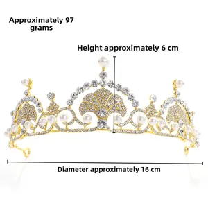 Detail view of gold princess tiara with pearls and crystals measuring 16x6cm