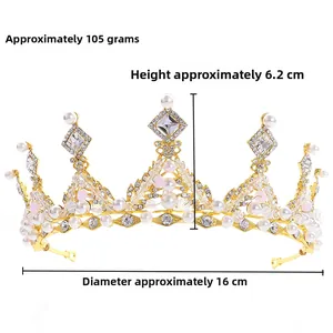 Close-up of golden bridal crown with white pearls and clear crystals, 16cm diameter