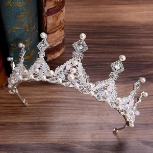 Handcrafted silver bridal crown with white pearls and sparkling crystal rhinestones