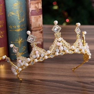 Baroque bridal crown with white pearls and sparkling crystals on a golden frame