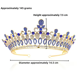 Detailed view of luxury baroque crown with blue and white crystals on gold alloy