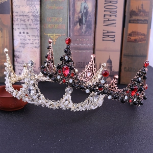 Detailed macro view of baroque bridal crowns with vintage crystals and red gemstones