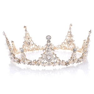 Elegant gold baroque bridal crown with white pearls and sparkling crystals on white background