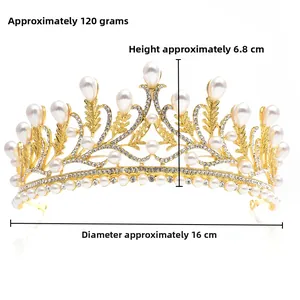 Detailed side view of golden bridal crown showing pearls, crystals and leaf design