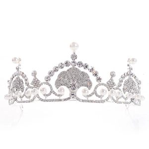 Detailed view of silver bridal tiara featuring white pearls and sparkling rhinestones